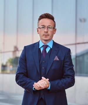 confident-businessman-dressed-in-an-elegant-suit-s-2021-08-28-00-59-34-utc-qb7xfg3qpkf8zi3kf6v1dqjy58fhc6cxkfeh5nbvv4